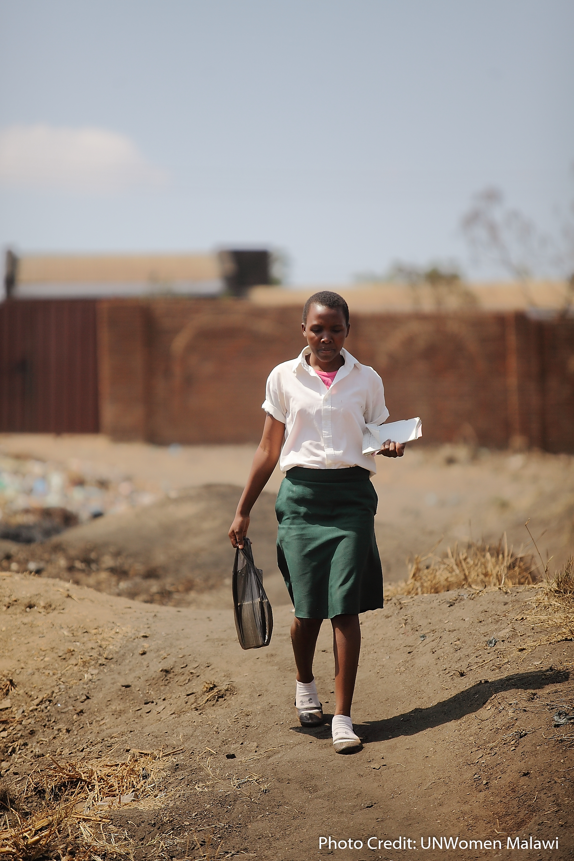 A girl walks to school