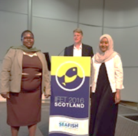 Chikondi (to the left) accepts her award at the Conference
