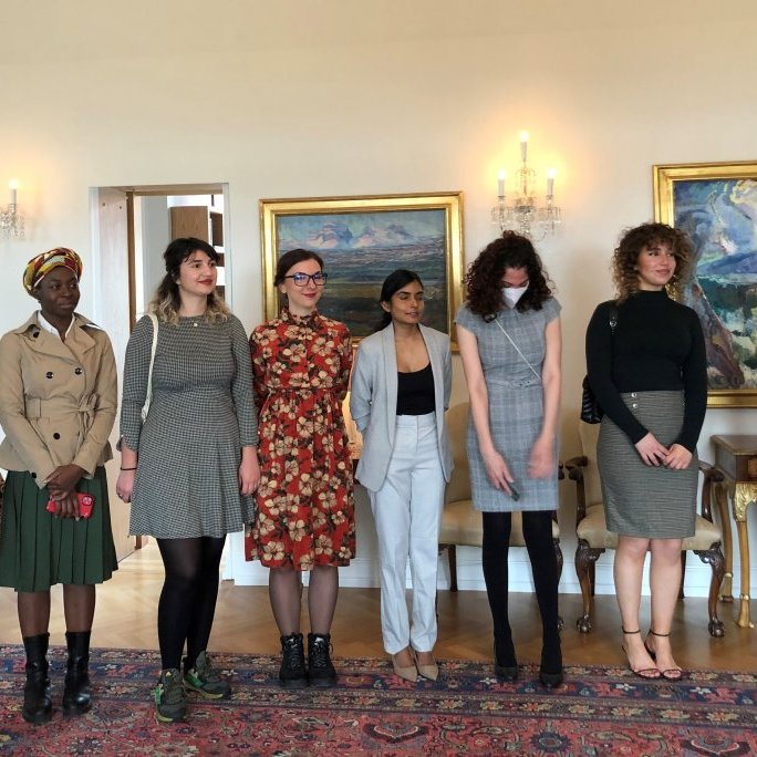 Nikky, Owusuwaa, Erza, Natalia, Sandani, Razan, Balqees and Ankita listen to the president of Iceland welcome them to Bessastaðir.