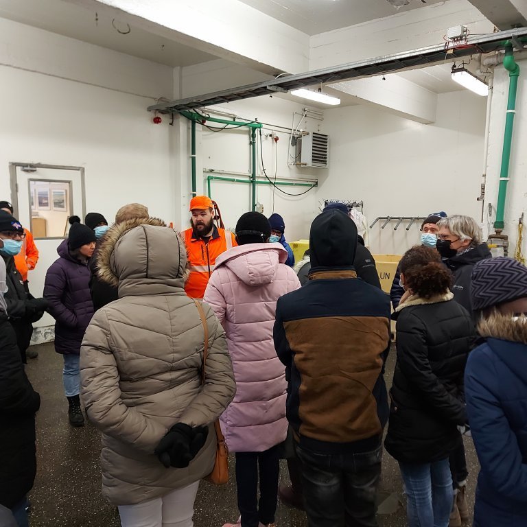 Benedikt explains how the fish auction works