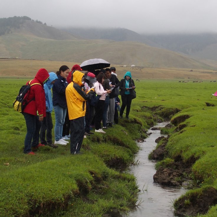 Course participants exploring condition of the riparian area and discussing signs of degradation & potential management options in the field trip of our course