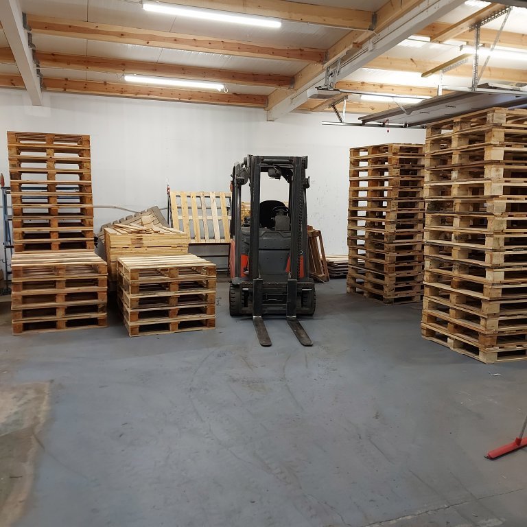 Stacking the newly-made pallets