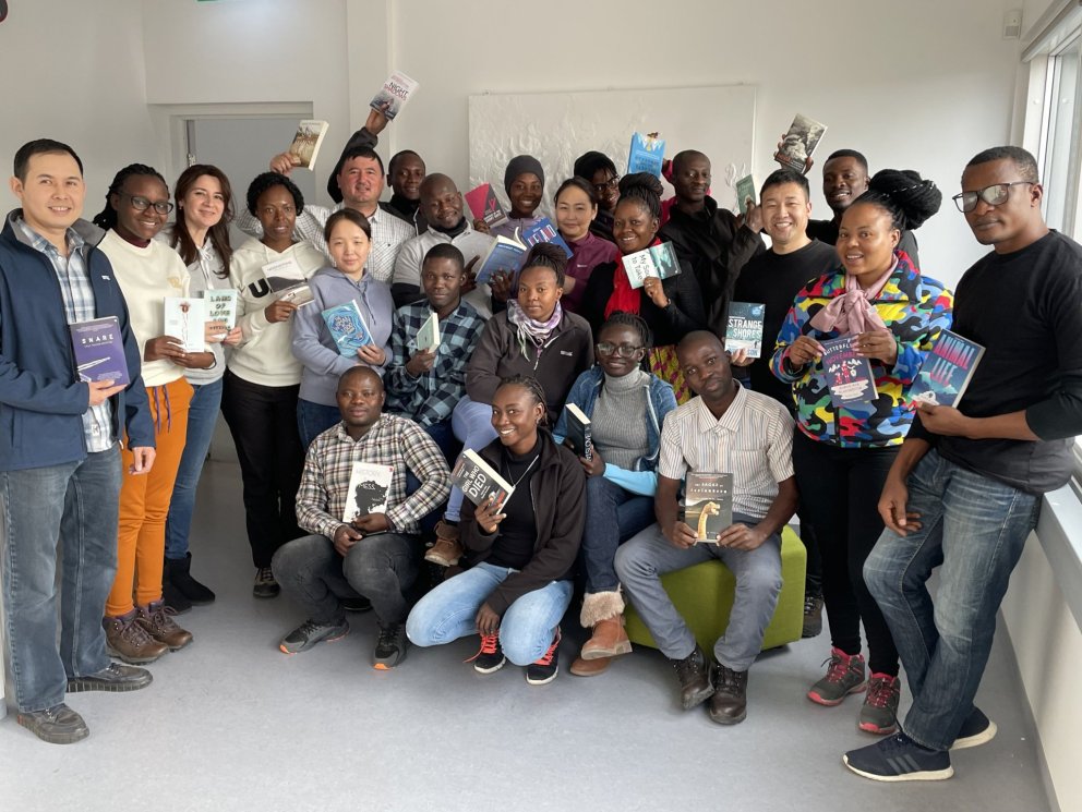 GRÓ LRT fellows with a some of the books donated by Reykjavik UNESCO City of Literature.