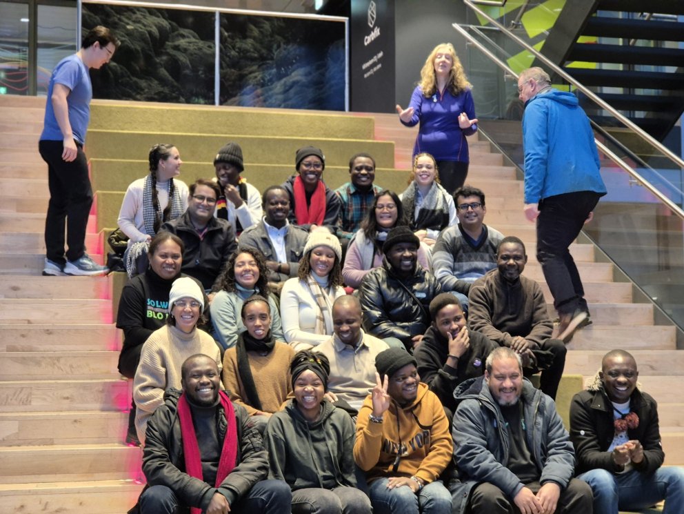 GRÓ FTP fellows and staff pose on the stairs of the visitor´s centre at the Hellisheiði Power Statio&hellip;