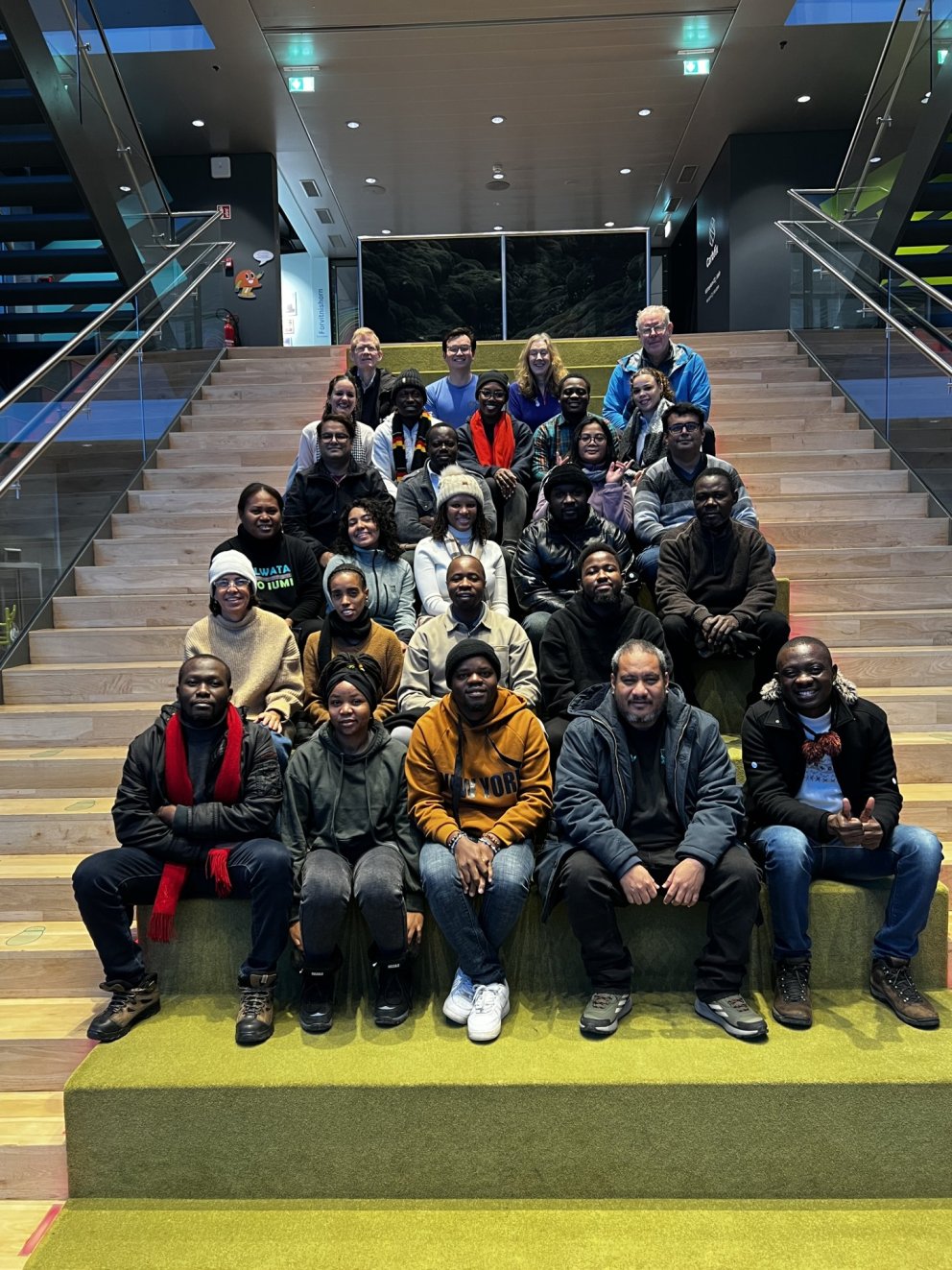 GRÓ FTP fellows and staff pose on the stairs of the visitor´s centre at the Hellisheiði Power Statio&hellip;