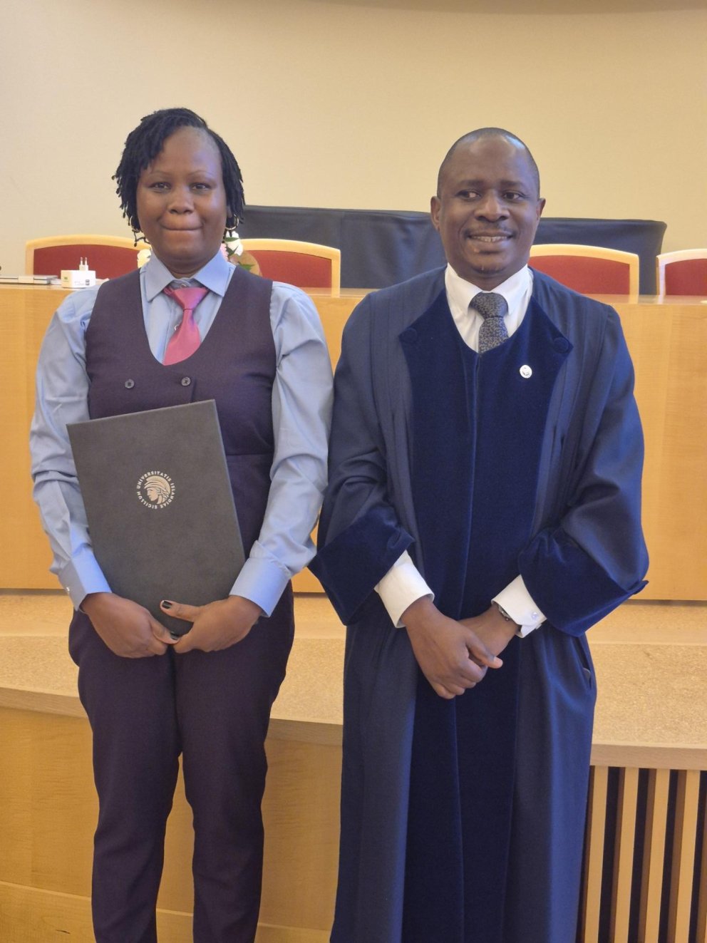 Safina and one of her opponents, Dr. Kasozi, Director of Research at the Buginyanya Research and Dev&hellip;