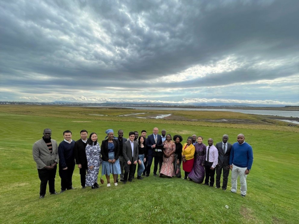 The President and the fellows with Bessastaðir wetland restoration site in the background