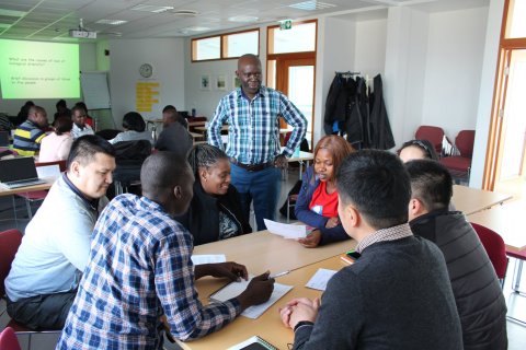 Dr Gerald Eilu with GRÓ LRT fellows in a group work session