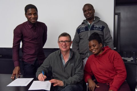 Some scholarship recipients and staff at the meeting.