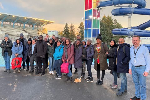 Fellows in front of the main outdoor pool joined by Árni Jónsson on the far right.